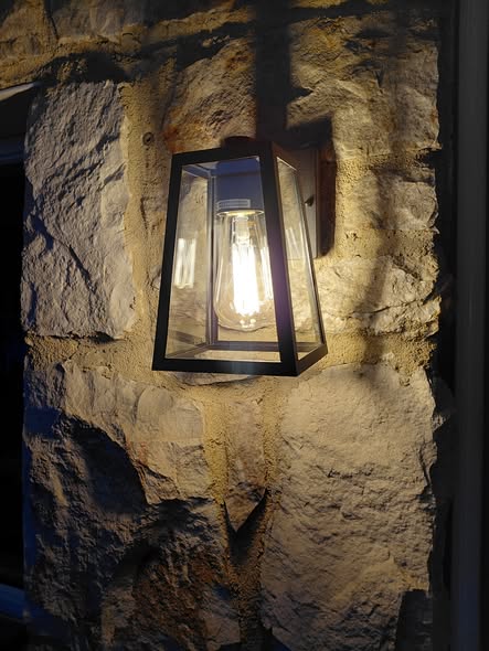 Completed exterior porch light installation