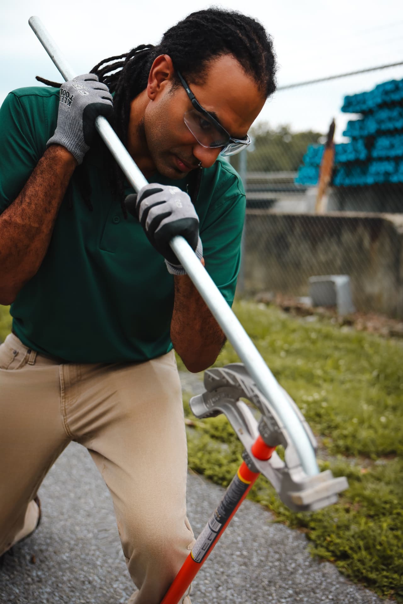 Luis Melecio bending electrical conduit with a hand bender
